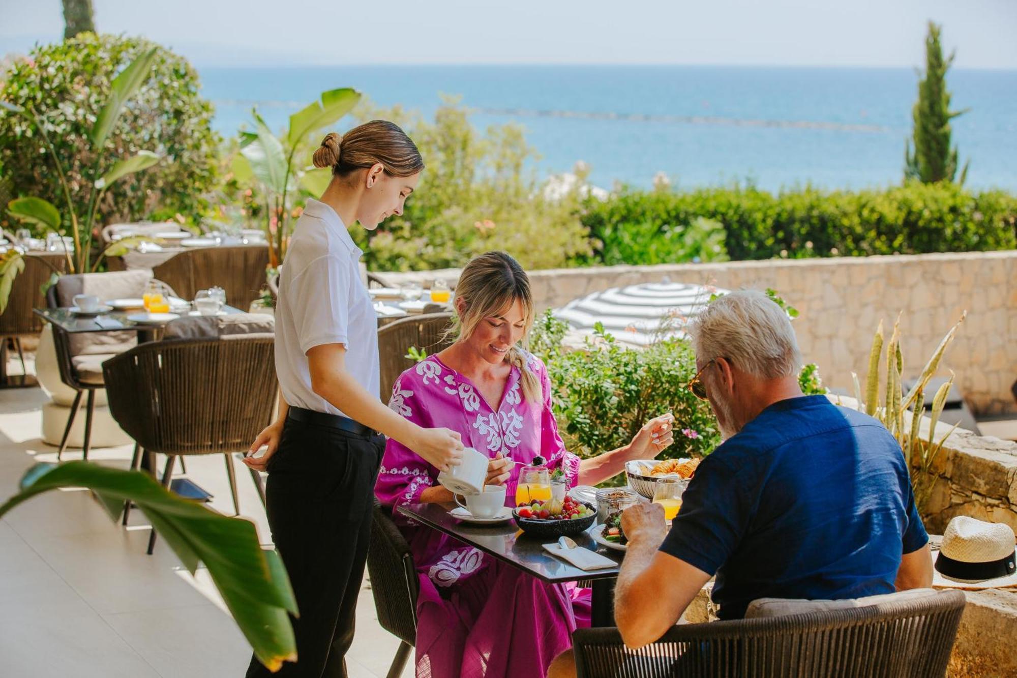 Royal Apollonia By Louis Hotels Limassol Exterior photo A waitress serving guests at a restaurant